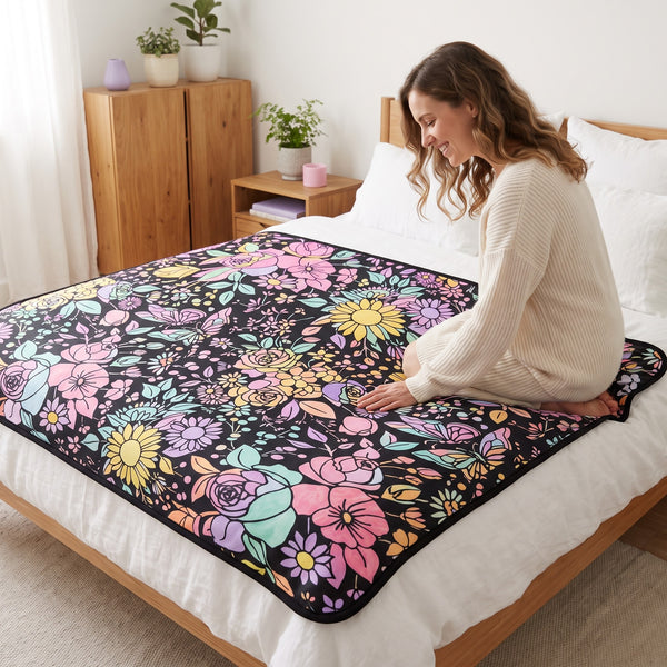Finished Flowers blanket, colored in bright colors, spread over a bed
