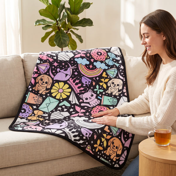 Finished Pets blanket, colored in bright colors, on a sofa